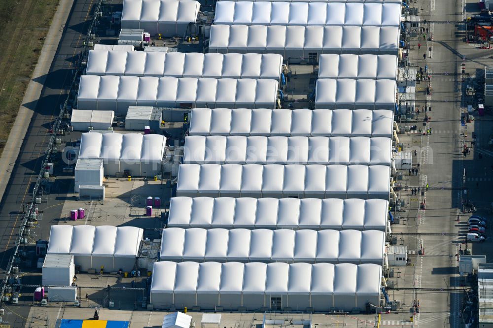 Berlin from above - Night lights and lighting refugee home and asylum accommodation tent camp as makeshift accommodation Ukraine Arrivals Center TXL in the district of Tegel in Berlin, Germany