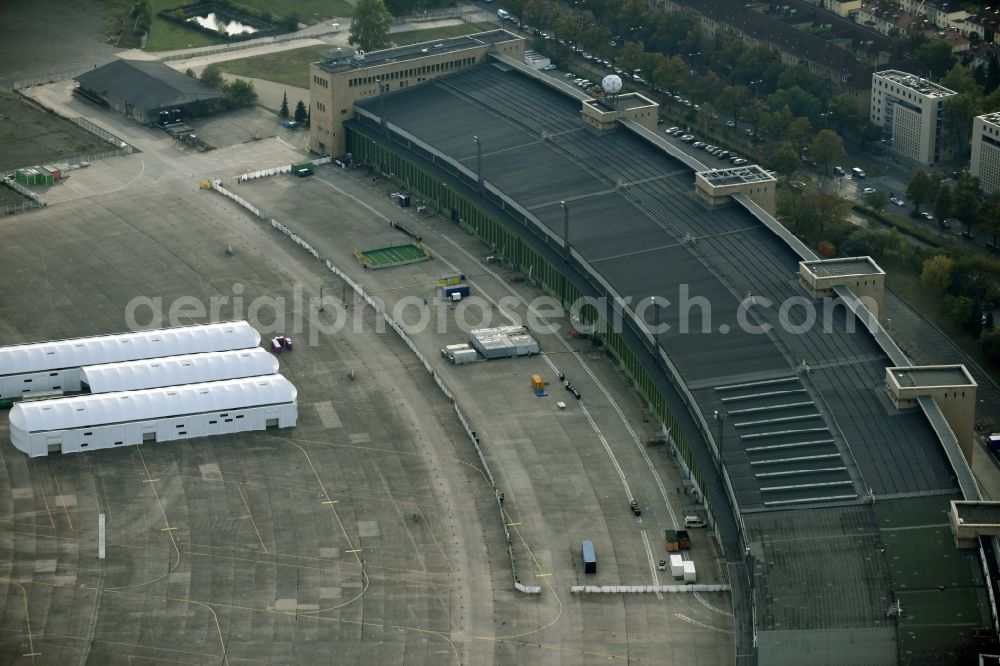 Aerial image Berlin - Premises of the former airport Berlin-Tempelhof Tempelhofer Freiheit in the Tempelhof part of Berlin, Germany. Its hangars are partly used as refugee and asylum seekers accommodations