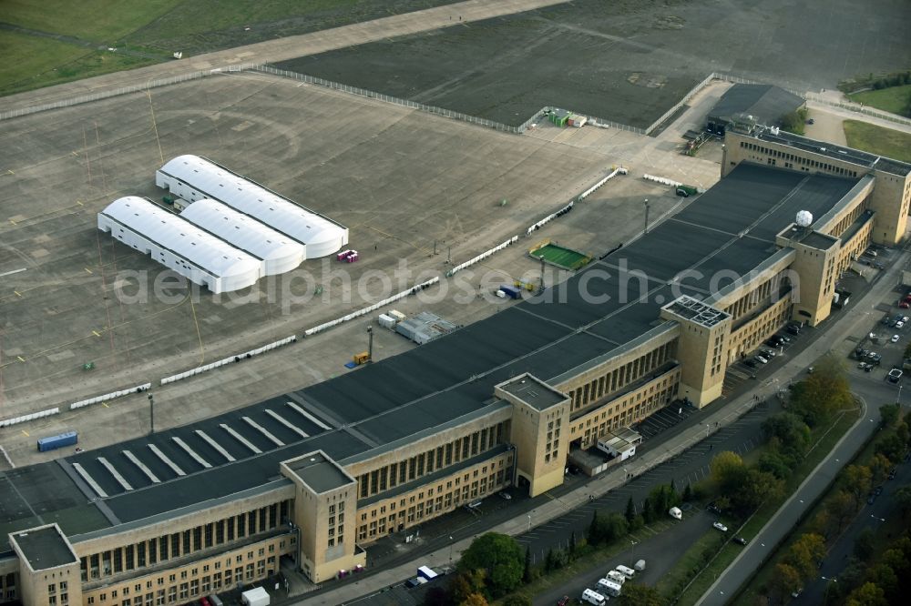 Berlin from above - Premises of the former airport Berlin-Tempelhof Tempelhofer Freiheit in the Tempelhof part of Berlin, Germany. Its hangars are partly used as refugee and asylum seekers accommodations