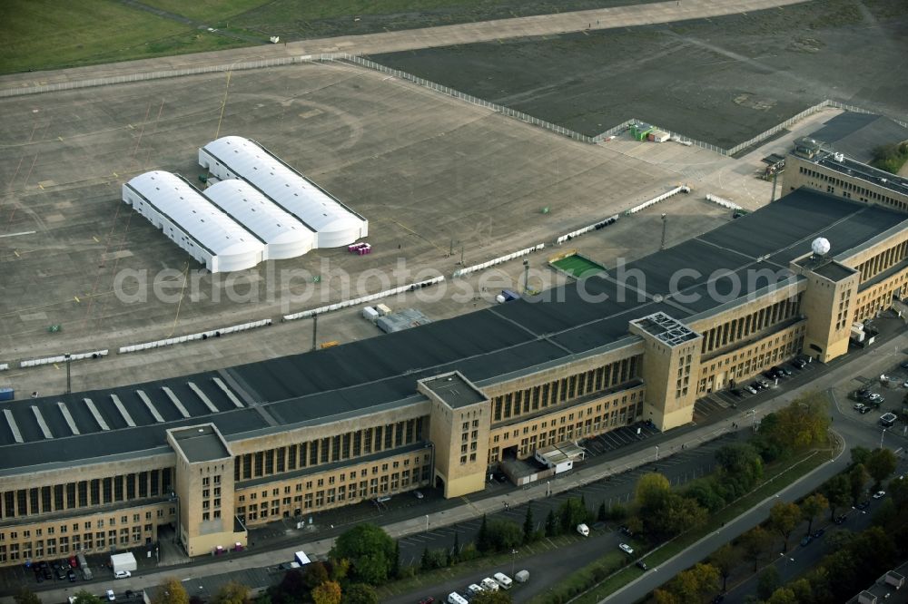 Berlin from the bird's eye view: Premises of the former airport Berlin-Tempelhof Tempelhofer Freiheit in the Tempelhof part of Berlin, Germany. Its hangars are partly used as refugee and asylum seekers accommodations