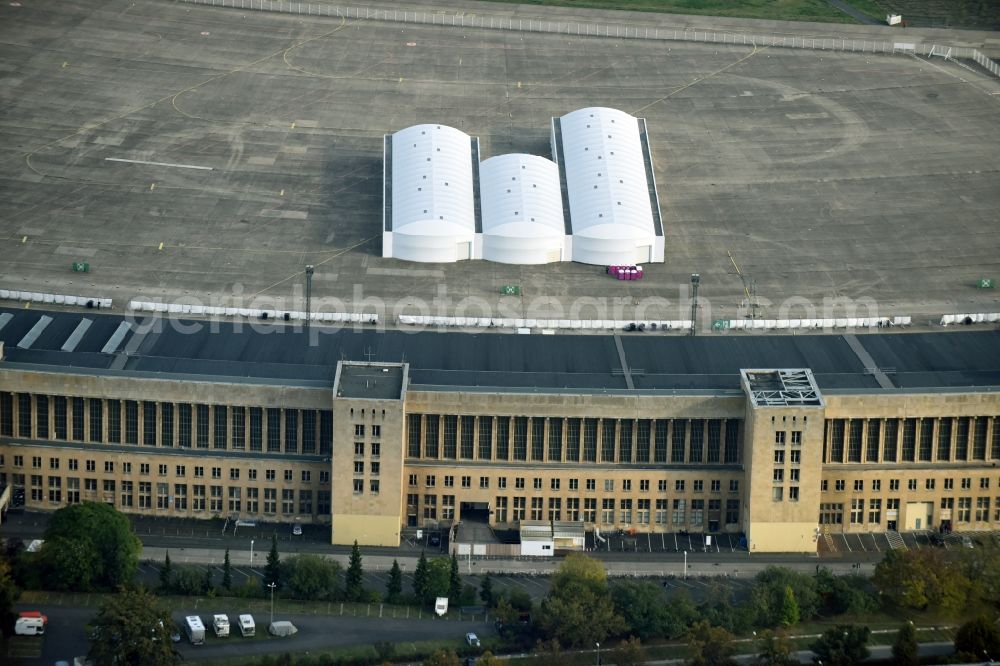 Aerial image Berlin - Premises of the former airport Berlin-Tempelhof Tempelhofer Freiheit in the Tempelhof part of Berlin, Germany. Its hangars are partly used as refugee and asylum seekers accommodations