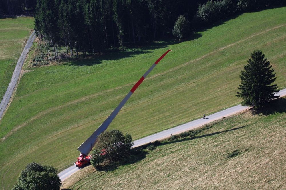 Schopfheim from the bird's eye view: A rotor blade of a wind turbine is moved to the construction site on the Rohrenkopf near Gersbach in Schopfheim in the state Baden-Wuerttemberg