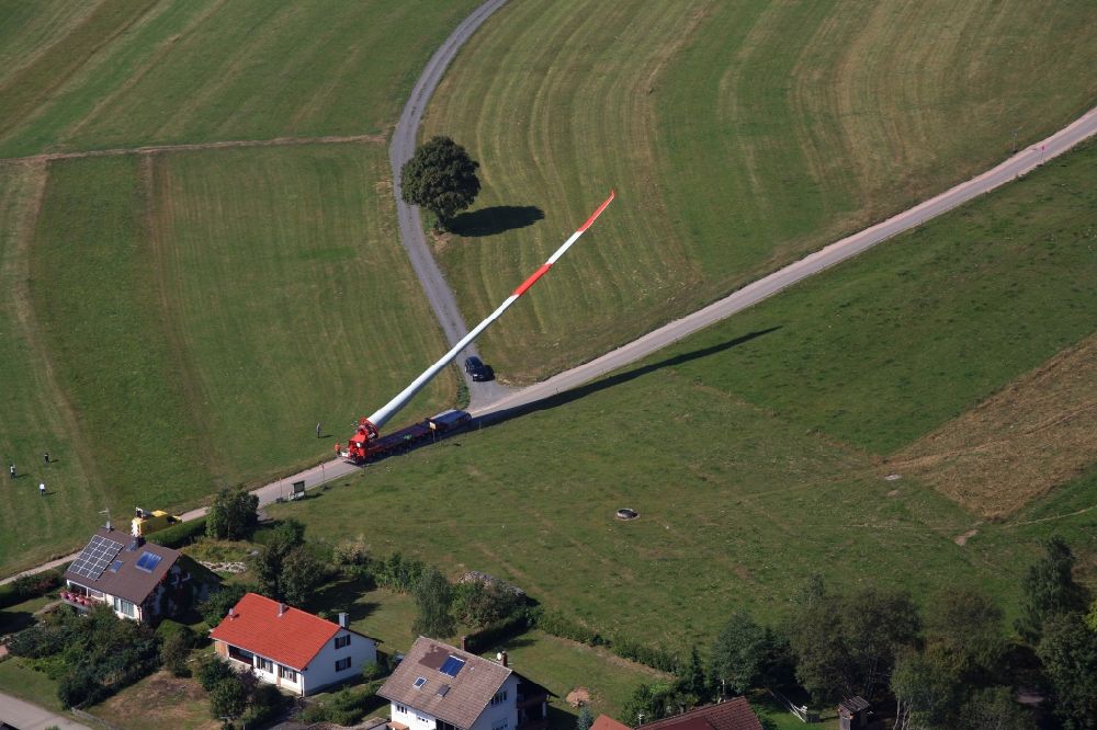 Aerial photograph Schopfheim - A rotor blade of a wind turbine is moved to the construction site on the Rohrenkopf near Gersbach in Schopfheim in the state Baden-Wuerttemberg