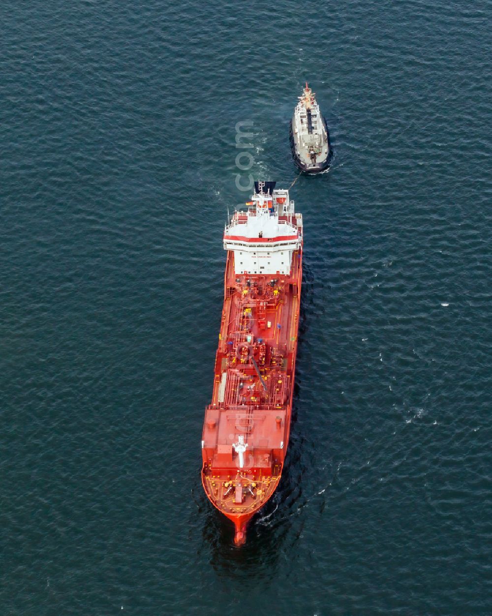 Kiel from above - Liquid gas LPG tanker and tugboat on the Kieler Foerde in Kiel in the state Schleswig-Holstein, Germany. The liquid gas tanker CORAL LEAF ( IMO 9404625 ) with the assistance tug PARAT ( IMO 8128212 ) in waiting position in Holtenau