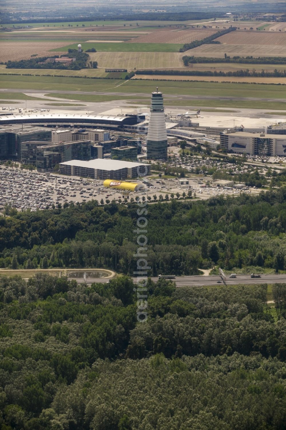 Schwechat from the bird's eye view: Tower and terminals on the premises of Vienna International Airport in Schwechat in Lower Austria, Austria