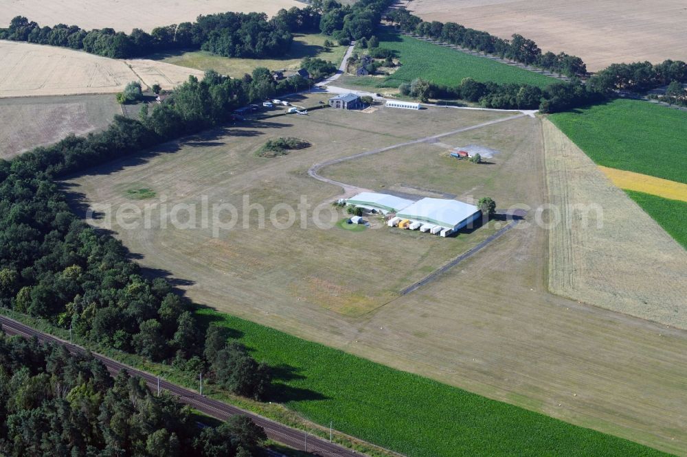 Aerial image Paulinenaue - Runway with tarmac terrain of airfield Bienenfarm GmbH in Paulinenaue in the state Brandenburg, Germany