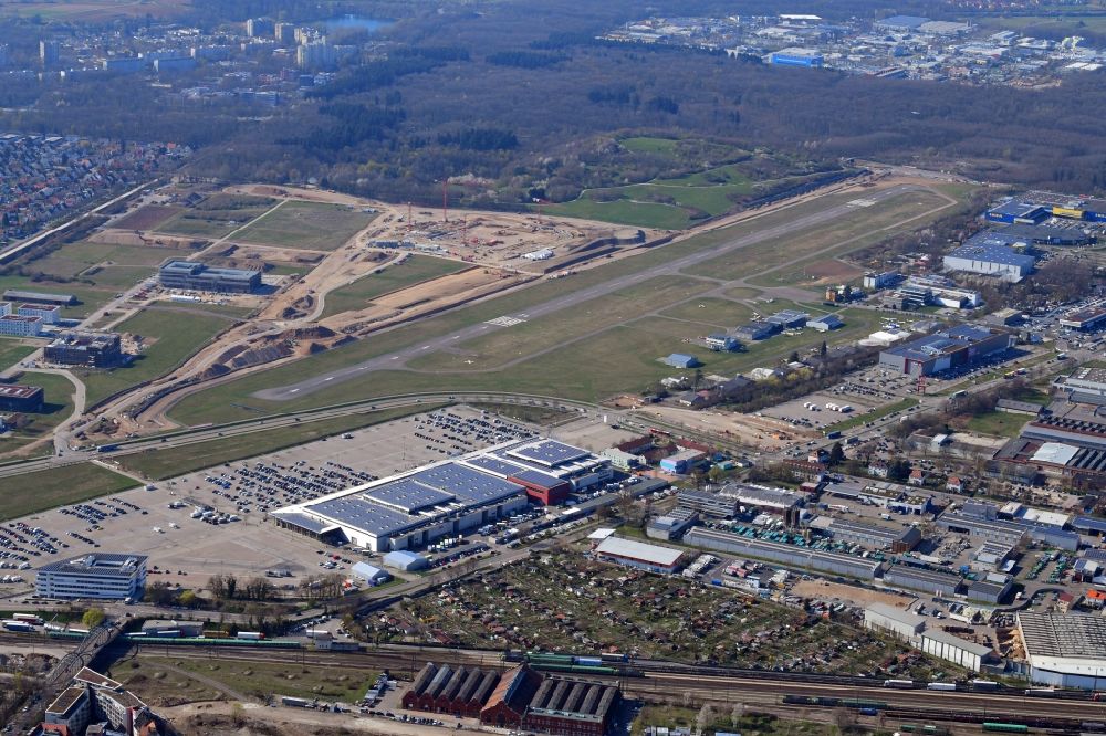 Aerial photograph Freiburg im Breisgau - Runway of airfield EDTF with fair grounds (right) and buildings of the Technical Faculty of the University (left) in Freiburg im Breisgau in the state Baden-Wurttemberg, Germany. On the construction works area the new stadium of the SC Freiburg is built