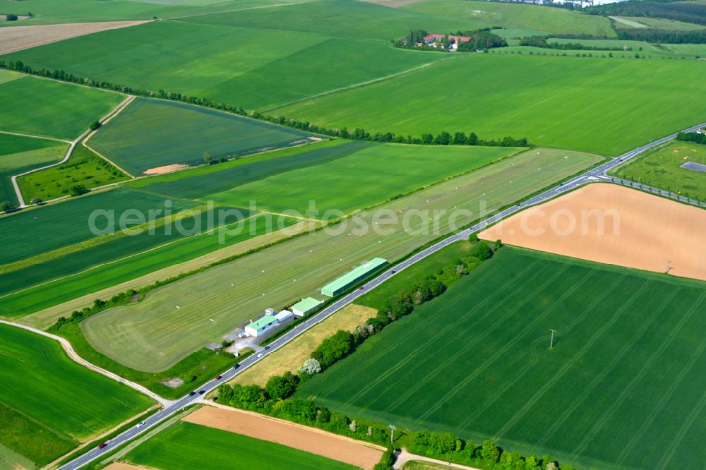 Aerial image Hettstadt - Runway with tarmac terrain of airfield on street Flugplatzstrasse in Hettstadt in the state Bavaria, Germany