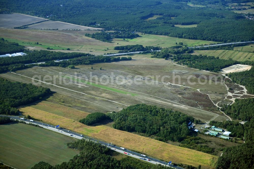 Saarmund from the bird's eye view: Runway with tarmac terrain of airfield in Saarmund in the state Brandenburg, Germany