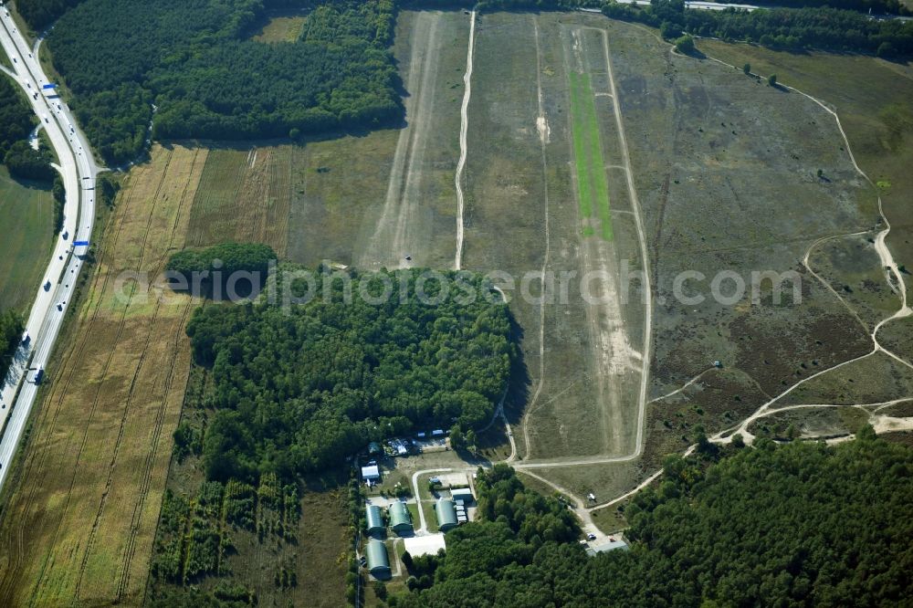 Saarmund from above - Runway with tarmac terrain of airfield in Saarmund in the state Brandenburg, Germany