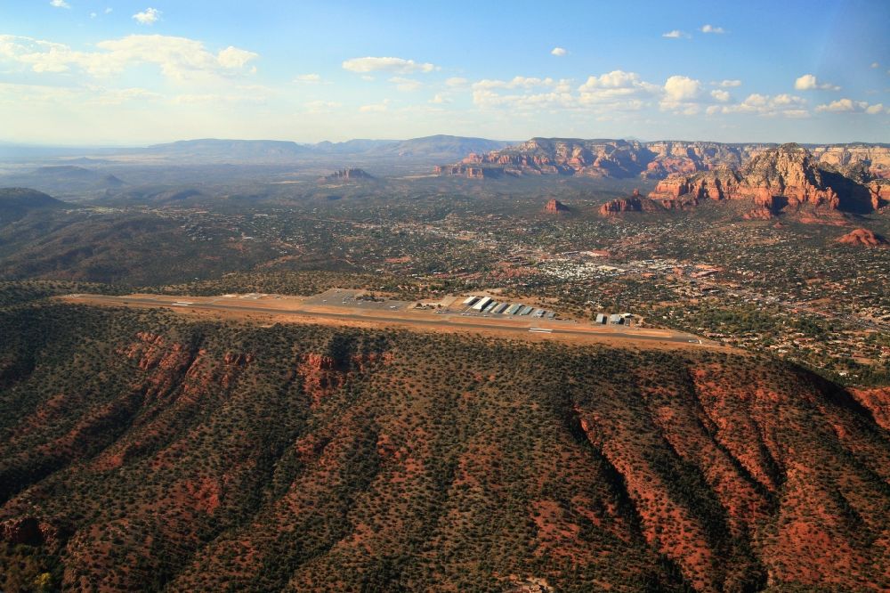 Aerial image Sedona - The red rocks are trademarks of the landscape at Sedona in the United States. The Sedona Airport is located on a high plateau and is considered the most scenic airfield and airport in USA