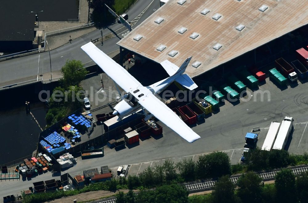 Aerial image Hamburg - Cessna 172N Skyhawk D-EAHN Aircraft in flight over the airspace in the district Hammerbrook in Hamburg, Germany
