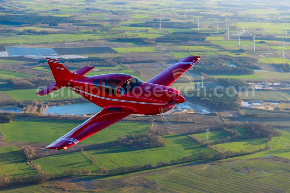 Deinste from the bird's eye view: Glasair SH2R Aircraft in flight over the fields above Deinste in the state Lower Saxony, Germany