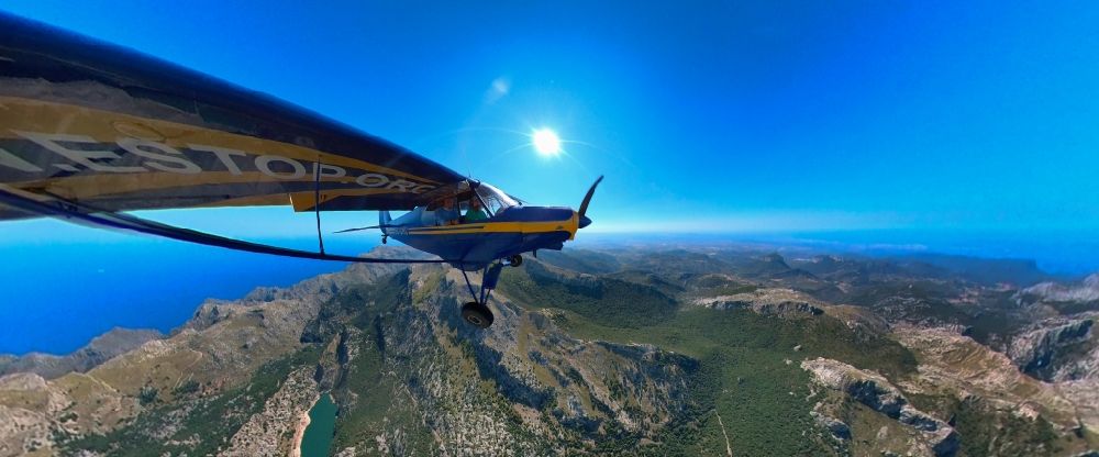 Escorca from above - Piper PA-18-150 Super Cub with the identifier EC-CKC Aircraft in flight over the Puig Major in airspace in Escorca at Serra de Tramuntana in Balearic island of Mallorca, Spain