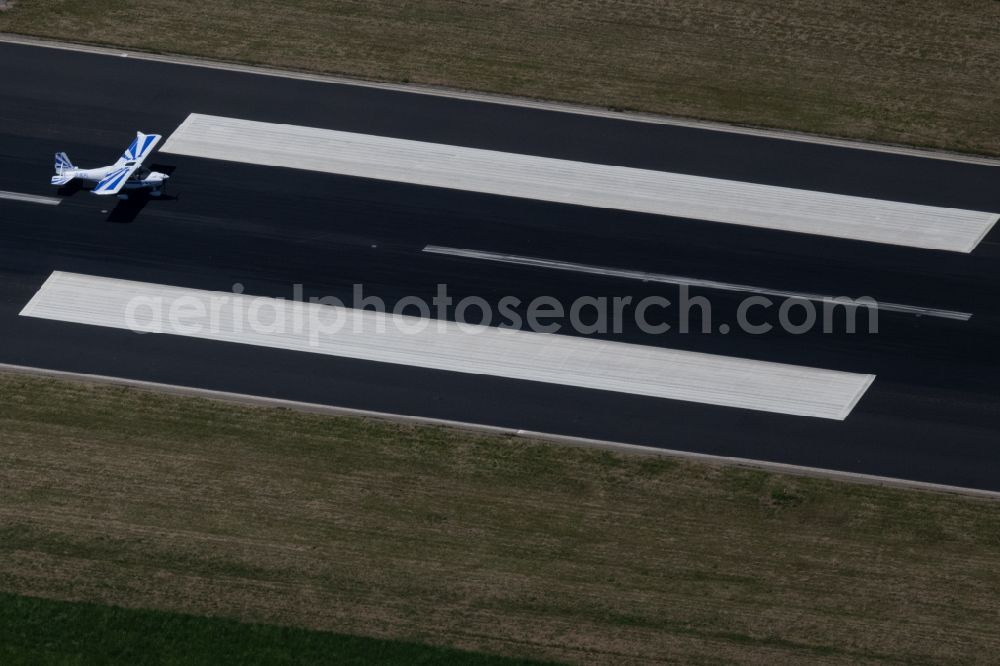 Aerial photograph Friedrichshafen - Airplane on the runway of the airfield - airport in Friedrichshafen on Lake Constance in the state Baden-Wuerttemberg, Germany