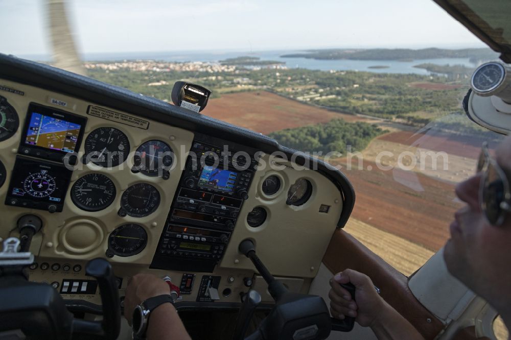 Aerial image Medulin - Cockpit of Cessna 172 Aircraft in flight over the airspace in Medulin in Istrien - Istarska zupanija, Croatia