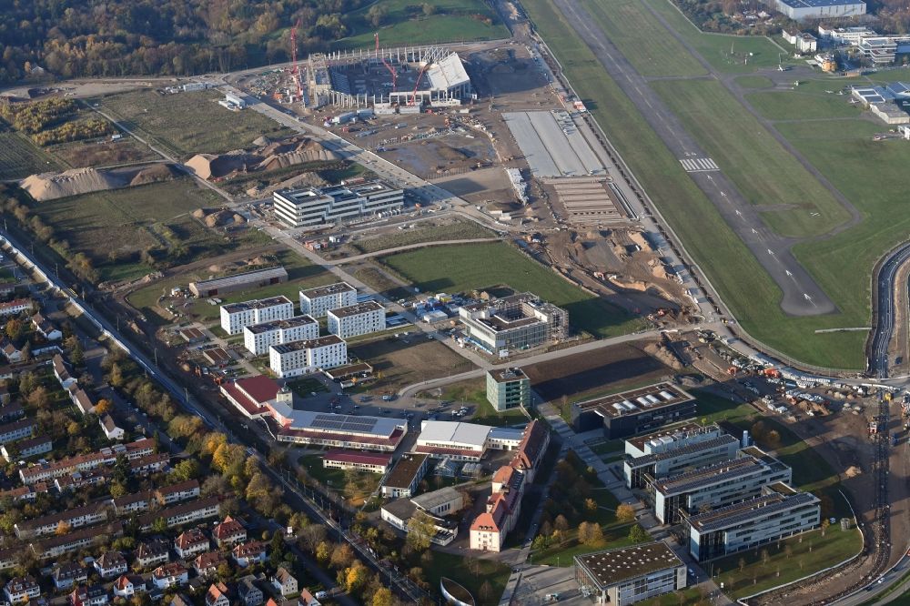 Aerial image Freiburg im Breisgau - Research building and office complex of Albert-Ludwigs-Universitaet Freiburg on Georges-Koehler-Allee next to the construction works of the stadium for sports club Freiburg in Freiburg im Breisgau in the state Baden-Wurttemberg, Germany