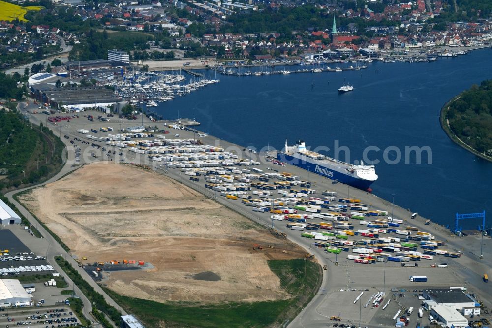 Travemünde from the bird's eye view: Construction site of building complex and distribution center on the site of Terminal Skandinavienkai in the district Ivendorf in Travemuende in the state Schleswig-Holstein, Germany