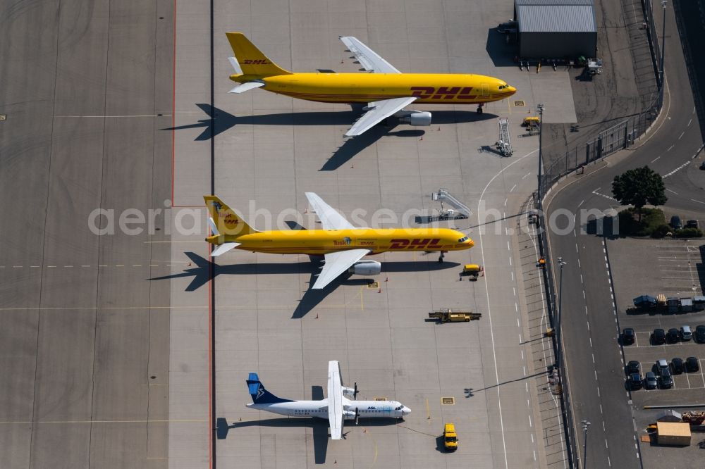 Neuhausen auf den Fildern from the bird's eye view: Freight plane cargo machine - aircraft of the DHL rolling on the apron of the airport in Neuhausen auf den Fildern in the state Baden-Wuerttemberg, Germany