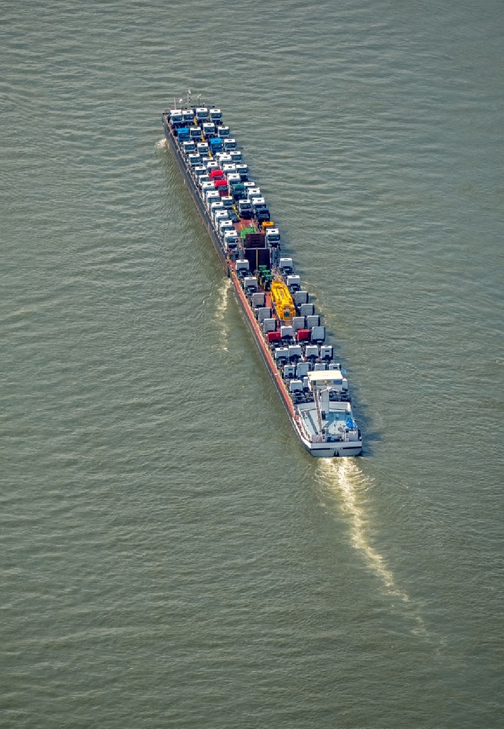 Aerial image Duisburg - Cargo ship on the inland shipping waterway of the river course of the Rhine river in Duisburg in the state North Rhine-Westphalia, Germany