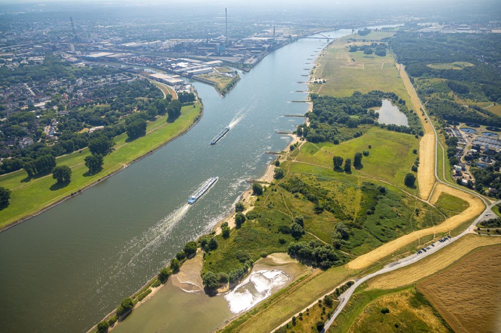 Duisburg from the bird's eye view: Cargo ship on the inland shipping waterway of the river course of the Rhine river in Duisburg in the state North Rhine-Westphalia, Germany