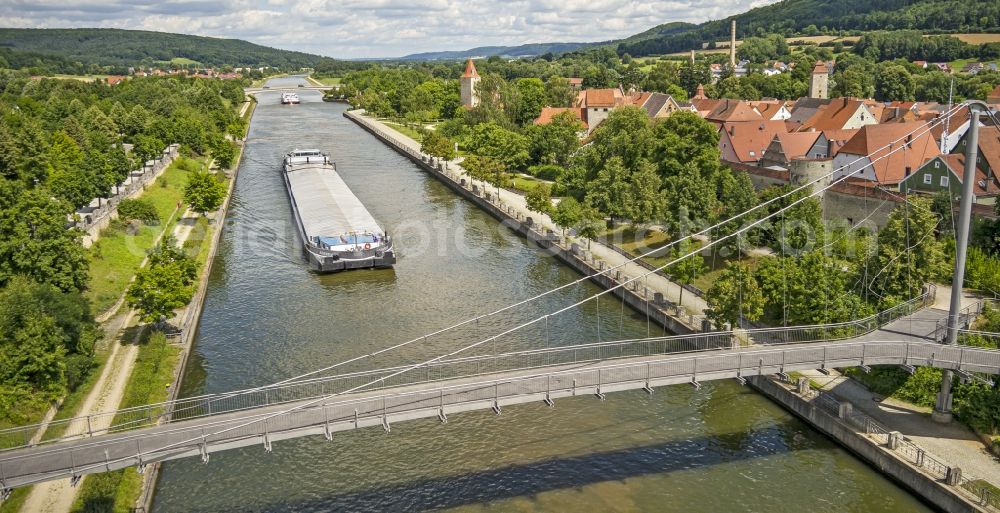 Berching from above - Cargo ships and bulk carriers on the inland shipping waterway of the river course of Main-Donau-Kanal in Berching in the state Bavaria, Germany