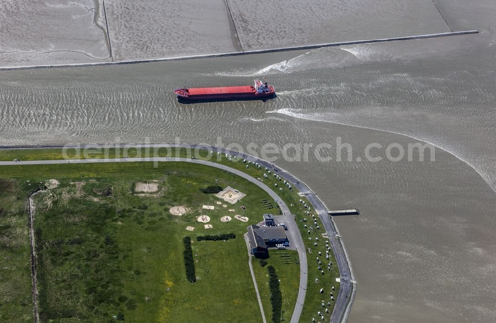 Aerial image Husum - Freighter and bulk freight freighter on the Husumer meadow with direction of the traffic harbour in Husum in the federal state Schleswig-Holstein