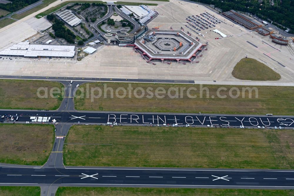 Berlin from above - Freedom Dinner on the blocked runway with a table arrangement to form letters of the words BERLIN LOVES YOU on the grounds of the former airport in the Tegel district in Berlin, Germany