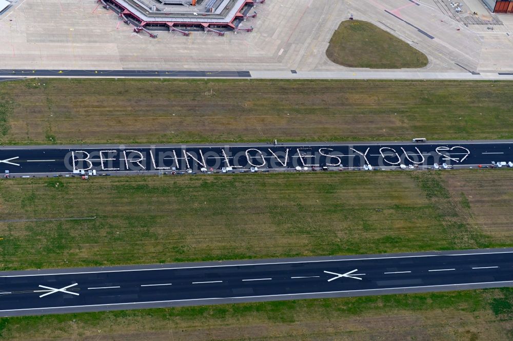 Berlin from the bird's eye view: Freedom Dinner on the blocked runway with a table arrangement to form letters of the words BERLIN LOVES YOU on the grounds of the former airport in the Tegel district in Berlin, Germany