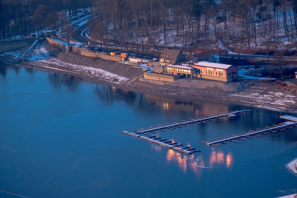 Aerial image Möhnesee - Open air restaurant cafe Solo in the evening light on the shore of the Moehnesee in the wintry snow-covered district of Guenne in Moehnesee in the federal state North Rhine-Westphalia