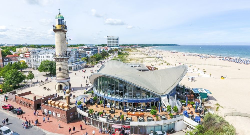 Aerial photograph Rostock - Tables and benches of open-air restaurants Gebaeude - Ensemble Leuchtturm - Teepott in the district Warnemuende in Rostock in the state Mecklenburg - Western Pomerania, Germany