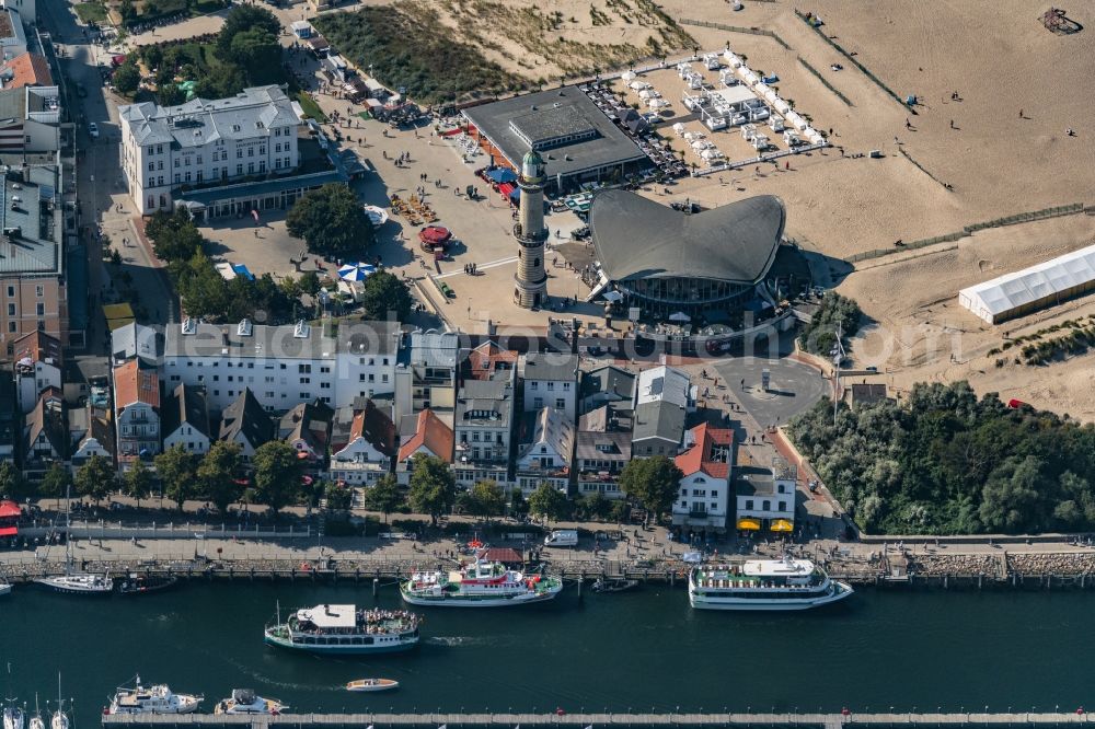 Aerial image Rostock - Tables and benches of open-air restaurants building - Ensemble Leuchtturm - Teepott in the district Warnemuende in Rostock in the state Mecklenburg - Western Pomerania, Germany
