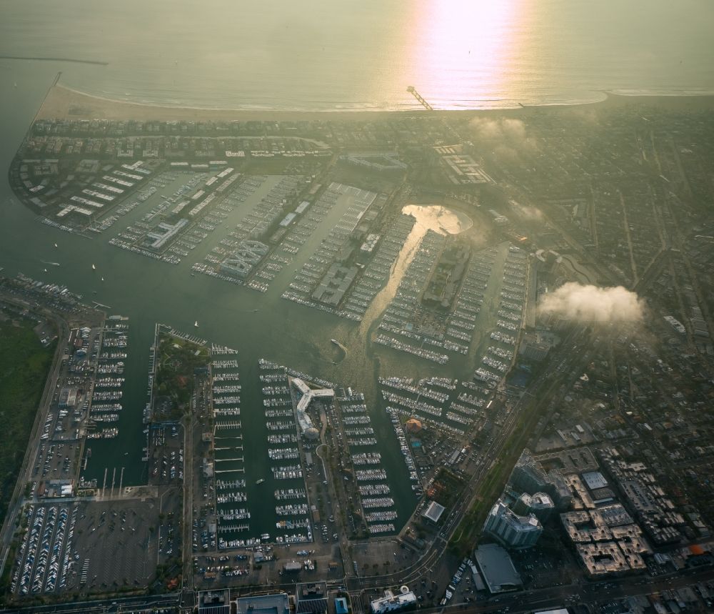 Aerial image Marina del Rey - Marina in low sunlight in Marina del Rey in California, USA. Marina del Rey is an unincorporated seaside community completely surrounded by the urban area of Los Angeles. Its Marina is the world's largest man-made small craft harbor
