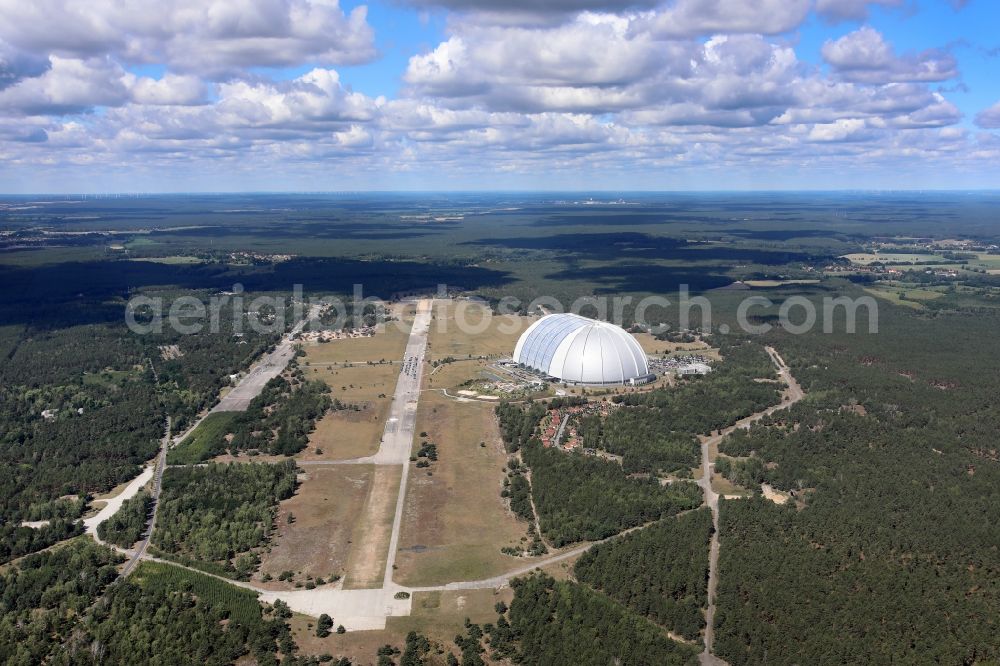 Krausnick from the bird's eye view: Complete complex of the Theme Park Tropical Islands with air hall, outdoor pool, campsite, holiday homes and former airfield in Krausnick in the state of Brandenburg, Germany