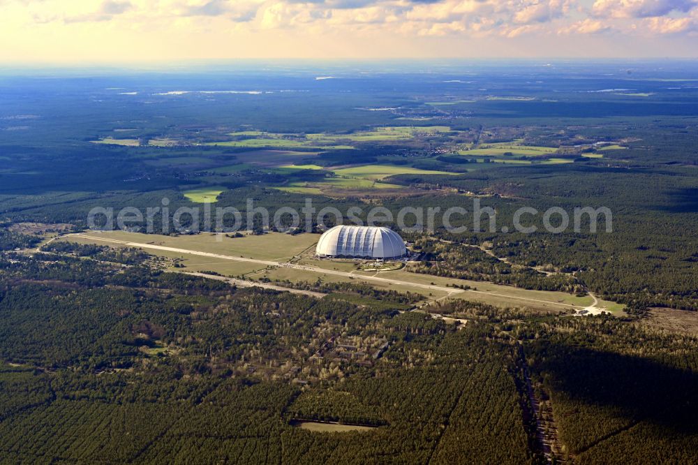 Krausnick from the bird's eye view: Complete complex of the Theme Park Tropical Islands with air hall, outdoor pool, campsite, holiday homes and former airfield on street Tropical-Islands-Allee in Krausnick in the state of Brandenburg, Germany