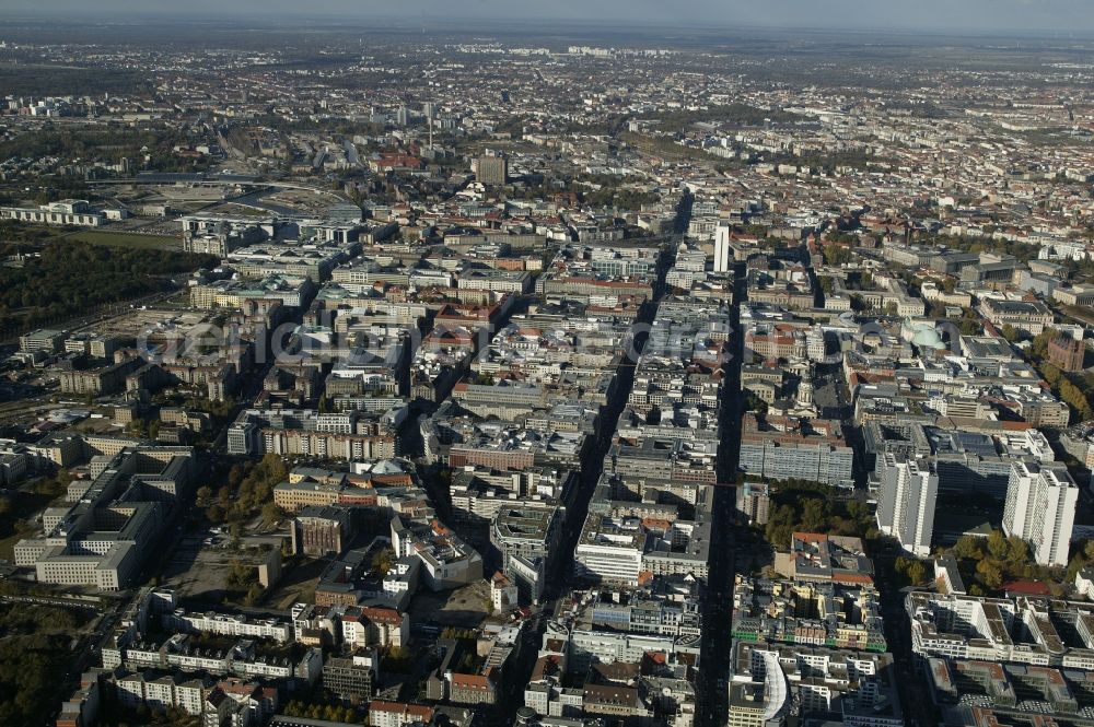 Aerial photograph Berlin - Between the parallel business Friedrichstrasse, Glinka Street, Charlotte Street and Markgrafenstrasse in Berlin in the state of Berlin, the historic Friedrichstadt extends. This attractive residential and commercial district is characterized by a mix of quality real estate and major attractions such as the ensemble of buildings on the Gendarmenmarkt with the Konzerthaus Berlin, German and French Cathedrals. Specifically, the Friedrichstrasse is a popular shopping street. At its northern end is the high-rise International Trade Centre. East of the government district with the Reichstag building is the high-rise Charite. The striking building on the left side is the Federal Ministry of Finance