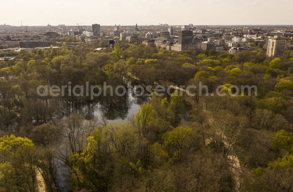 Berlin from the bird's eye view: Spring shoots of fresh green leaves from the tree tops in a wooded area the park in the district Tiergarten in Berlin, Germany