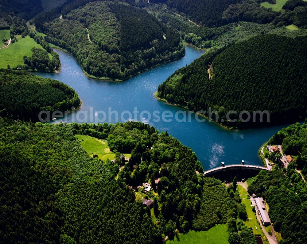 Aerial image Meinerzhagen - Fuerwigge dam in Meinerzhagen in the state of North Rhine-Westphalia. The barrage fixe between Meinerzhagen and Luedenscheid blocks five creeks, like the Fuerwigge and Verse. The dam was built 1902-1904 and can hold about 1.7 Mio. cubic metres. It's primary purpose is supply of drinking water. It is run by Ruhrverband