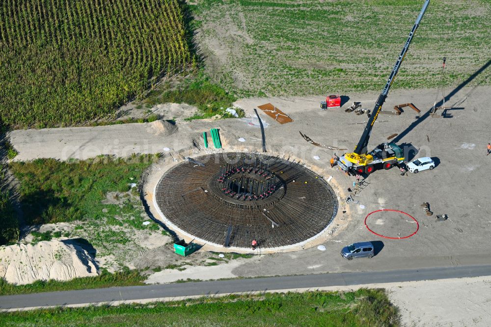 Aerial photograph Listerfehrda - Construction site for the construction of a steel and concrete foundation in a circular shape as a base for the installation of a WEA wind turbine - wind turbine on a field in Listerfehrda in the state Saxony-Anhalt, Germany