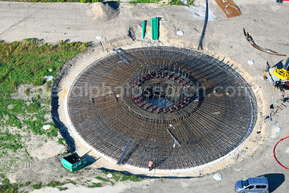 Listerfehrda from above - Construction site for the construction of a steel and concrete foundation in a circular shape as a base for the installation of a WEA wind turbine - wind turbine on a field in Listerfehrda in the state Saxony-Anhalt, Germany