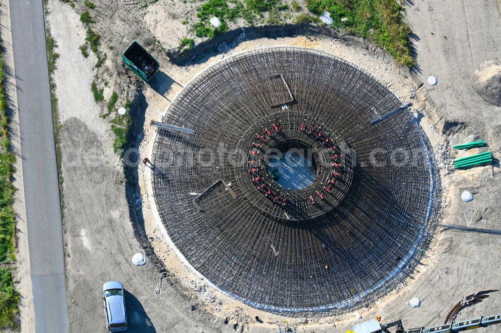 Aerial image Listerfehrda - Construction site for the construction of a steel and concrete foundation in a circular shape as a base for the installation of a WEA wind turbine - wind turbine on a field in Listerfehrda in the state Saxony-Anhalt, Germany