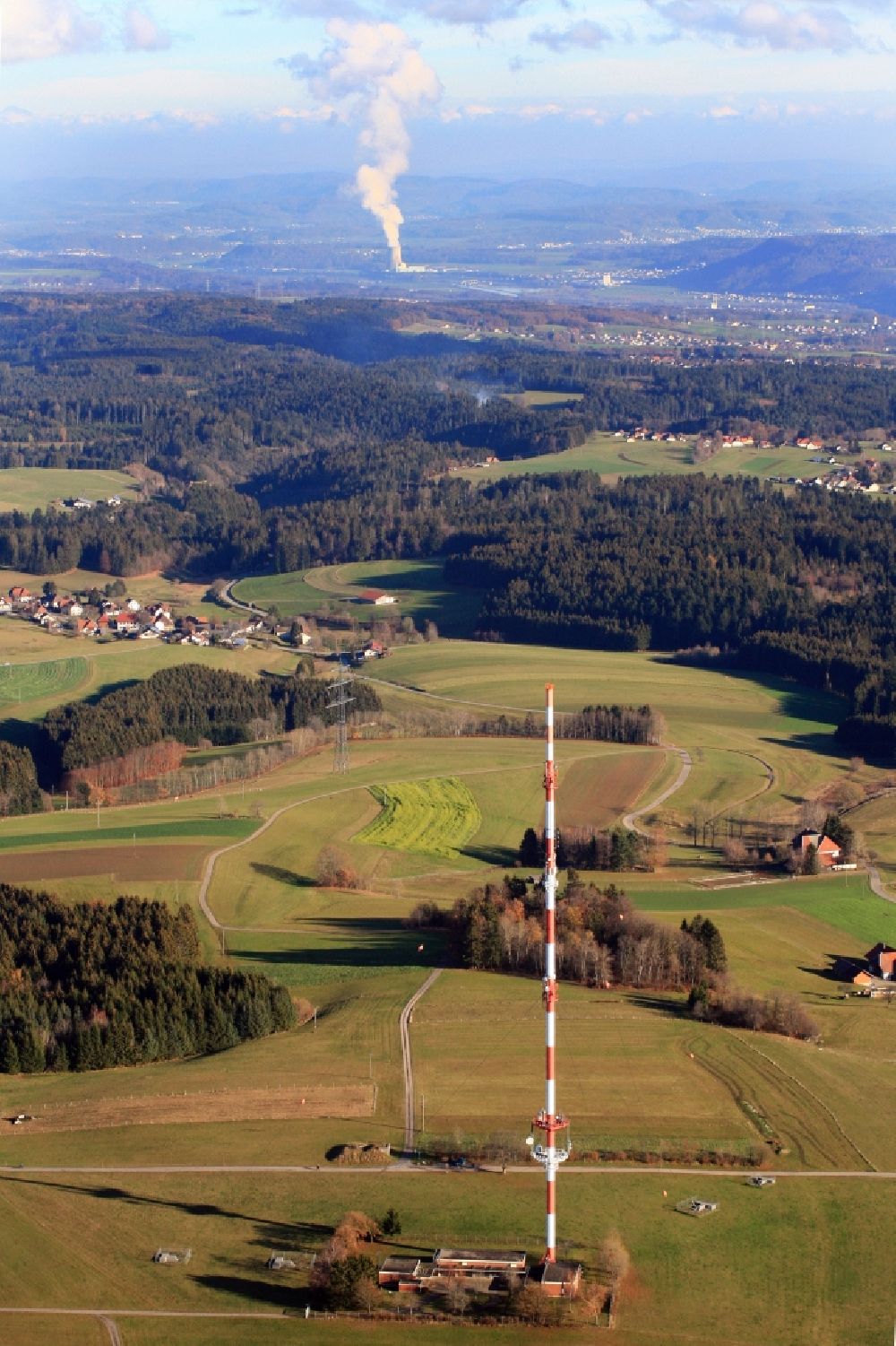 Rickenbach from the bird's eye view: Radio tower and transmitter on the plateau of the Hotzenwald in the Black Forest in district Bergalingen in Rickenbach in the state Baden-Wurttemberg, Germany. In the background the steam column of nuclear power plant Leibstadt in Switzerland