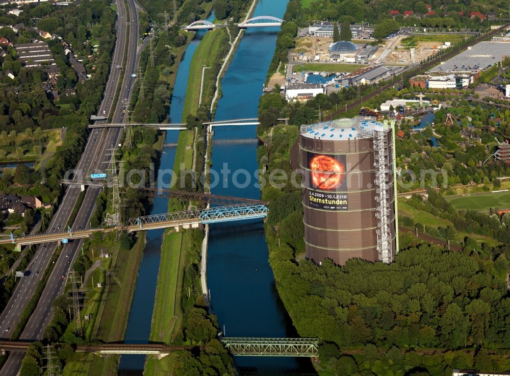 Aerial photograph Oberhausen - Night-time air picture from the Gasometer Oberhausen in Action extra layer 2012th The gasometer is the symbol of the city of Oberhausen, impressive document the construction and history of technology and venue