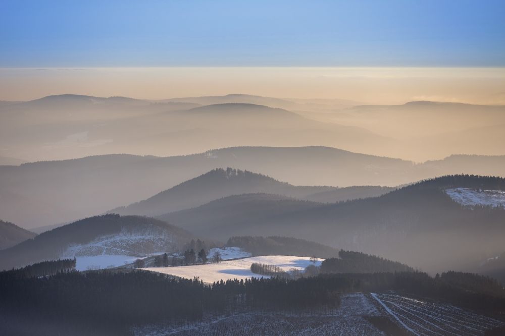 Aerial photograph Iserlohn - Relief over the mountains landscape in winter coverd with fog near Iserlohn in the state of Hesse
