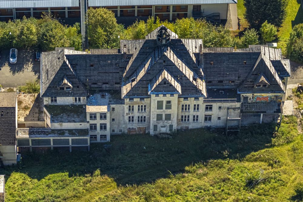 Aerial image Elspe - Building of the retirement home - senior residence of the Caritas-Tagespflege Elspe with a view of the ruins of the old St. Franziskus-Haus on Bielefelder Strasse in Elspe in the state North Rhine-Westphalia, Germany