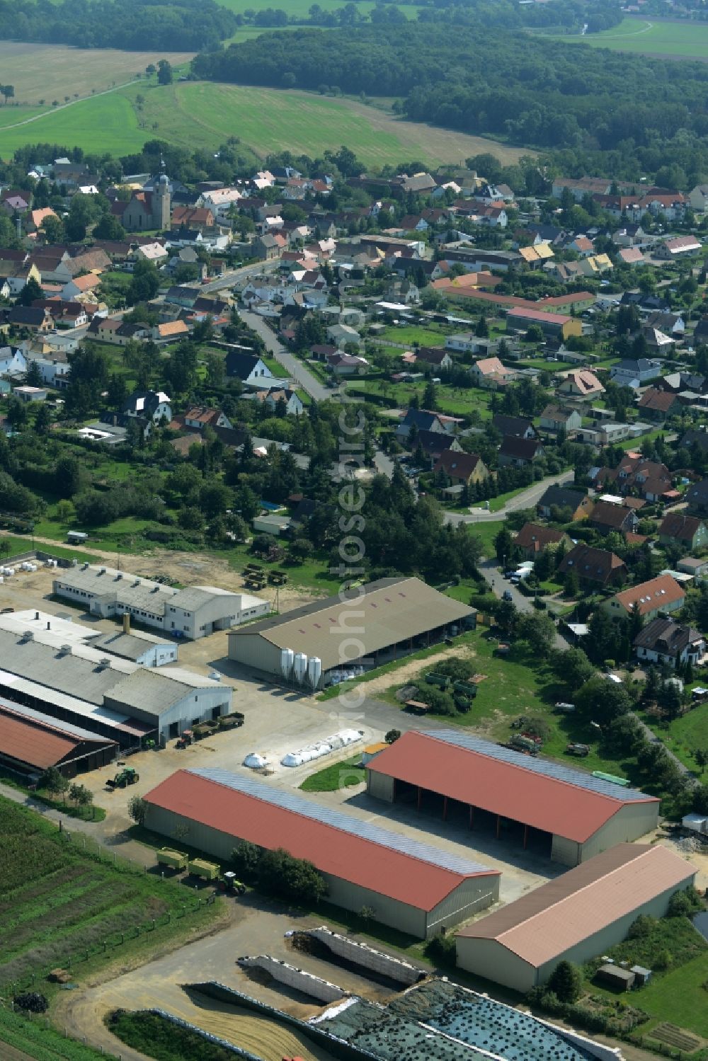Zschepplin from above - Farm and agricultural estate on the edge of Zschepplin in the state of Saxony. The compound with its halls and agricultural facilities is located in the North of the borough