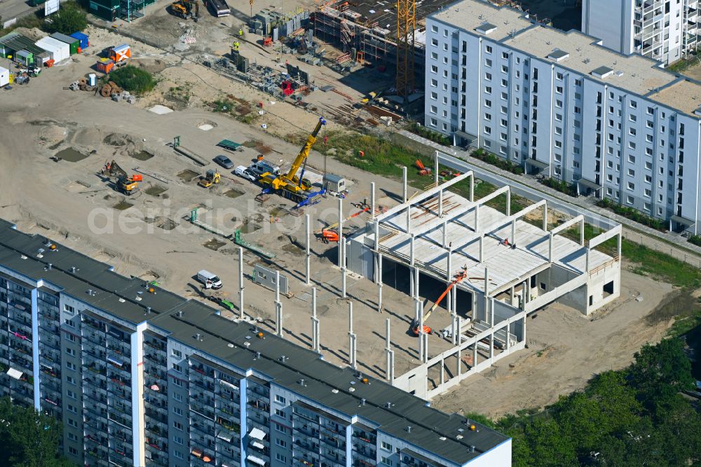 Berlin from above - Construction site for the construction of a new building for the furniture store moemax on the street Maerkische Allee in the district Marzahn in Berlin, Germany