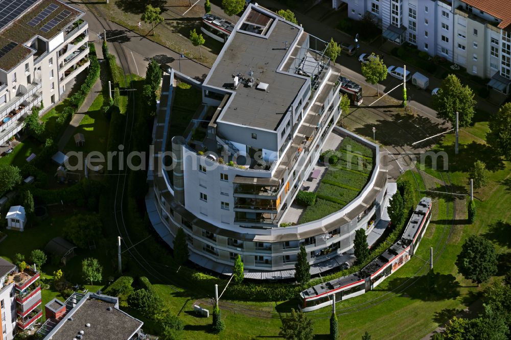 Freiburg im Breisgau from above - Building of an apartment building with green terraces in the tram - turning loop on the street Rieselfeldallee in the district Rieselfeld in Freiburg im Breisgau in the state Baden-Wuerttemberg, Germany