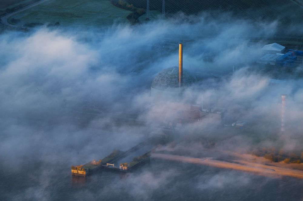 Stade from the bird's eye view: Buildings of the decommissioned reactor blocks and facilities in the morning fog of the nuclear power plant - Stade nuclear power plant in Stadersand in the state of Lower Saxony