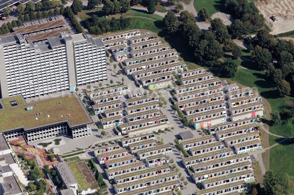Aerial image München - Building of the Olympiadorf residential complex in Munich, Bavaria. The one-storey bungalows and several high-rise buildings and terraces of the former Olympic village are used as the student dormitory